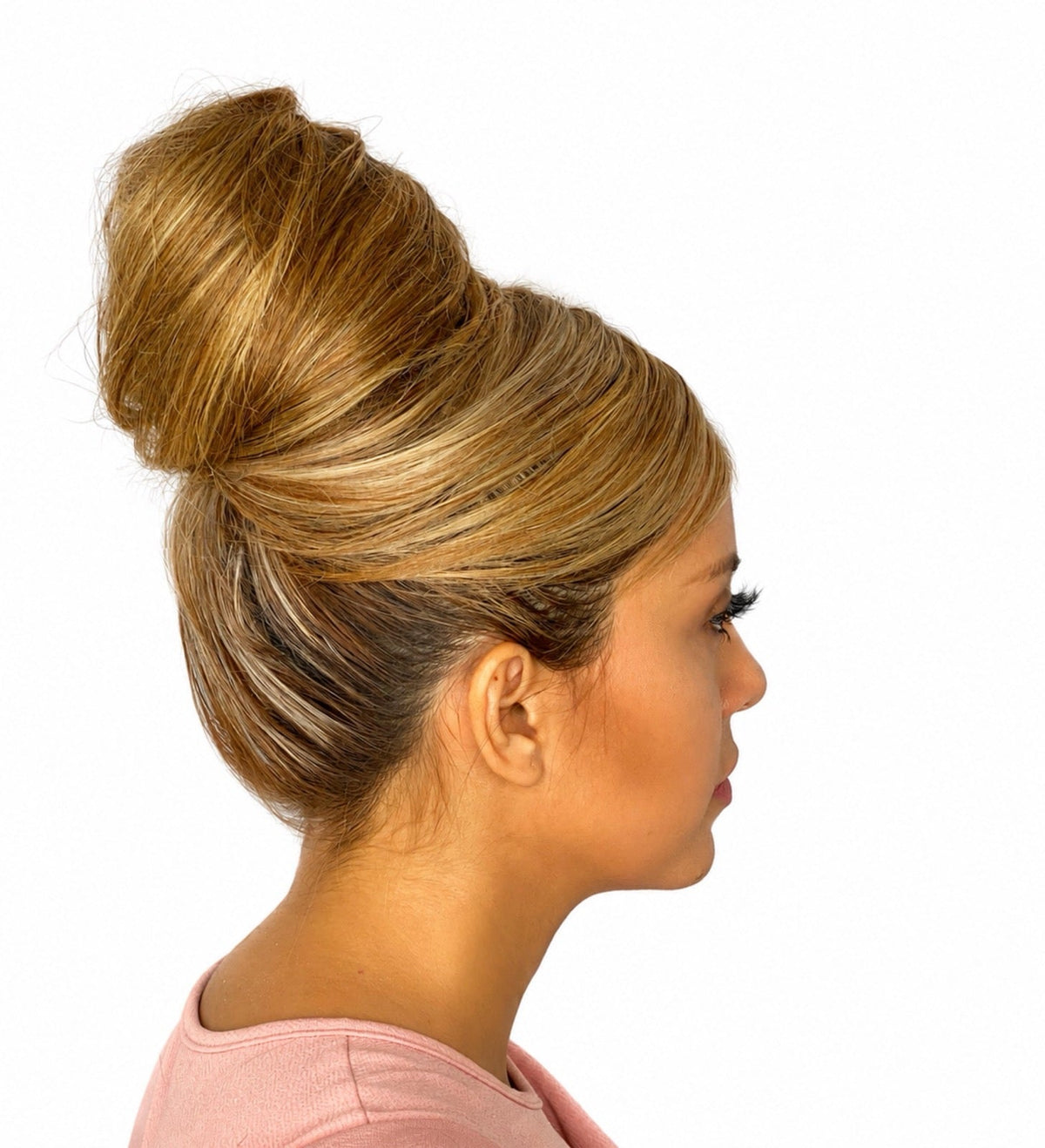 Smooth highlighted bun styled in a high updo